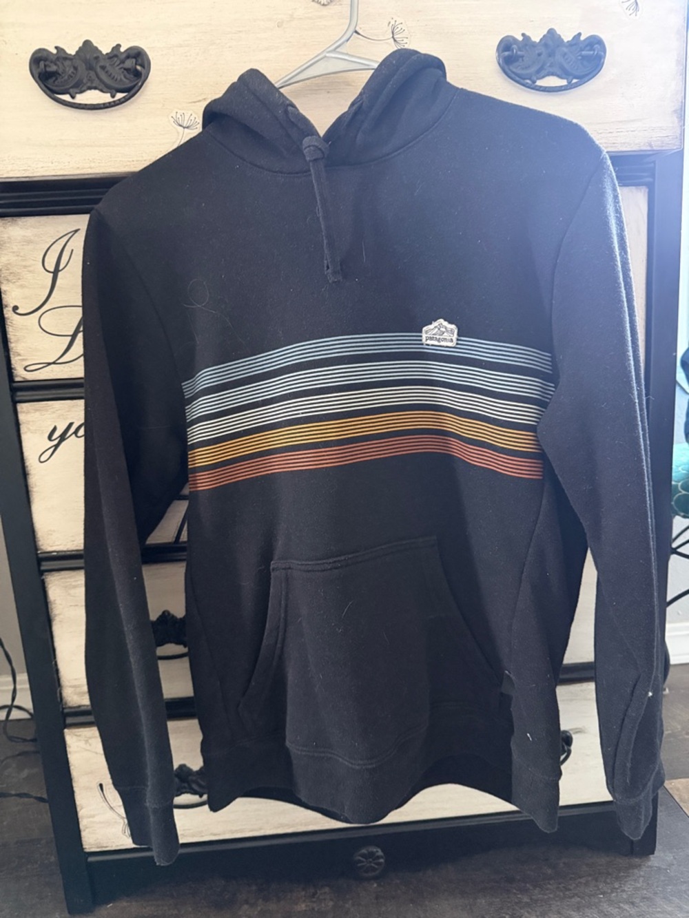 Patagonia Black Hoodie with Blue, Yellow and Brown Stripes